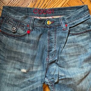 COOGI Jeans with red and plaid detail.